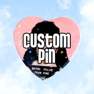 May include: A pink heart-shaped pin with a black and white image of a person with the text "custom pin" in white letters.