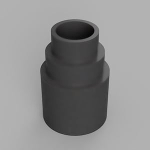 May include: A dark gray, cylindrical adapter with a stepped design. The adapter has a wide base, a mid-section, and a top opening. The object is made of a solid material and is suitable for connecting different sized pipes or hoses.