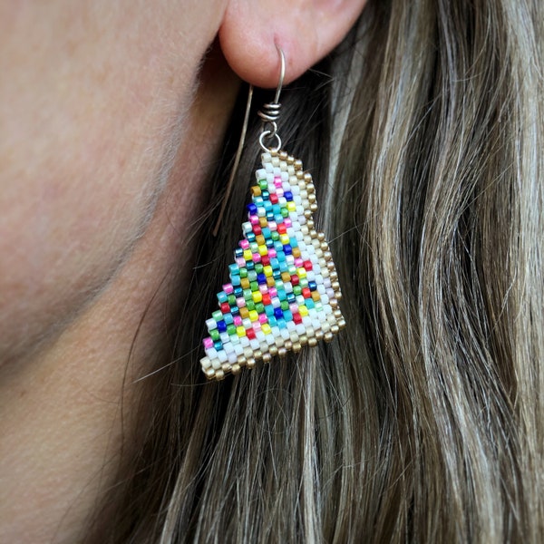 Fairybread earrings, woven with Miyuki Delica seed beads, on Argentium Silver 93.5 French earring hooks in a Kraft paper box.