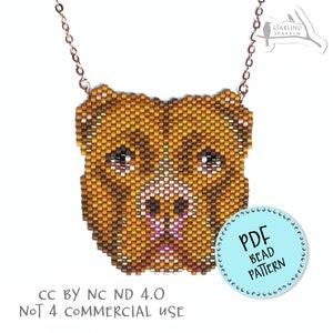 May include: A beaded necklace featuring a brown and gold dog face with pink nose and eyes. The necklace is on a gold chain and has a blue circle with the text "PDF Bead Pattern" on it. The text "CC BY NC ND 4.0 NOT 4 COMMERCIAL USE" is also visible.