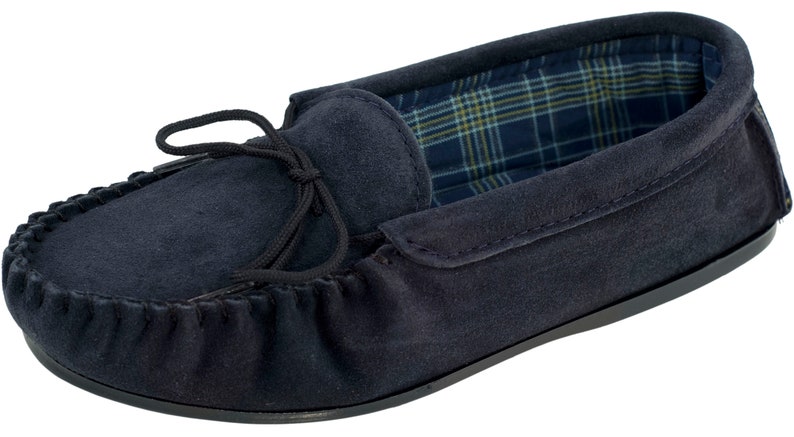 May include: Navy blue suede moccasins with a black tassel and a plaid lining.