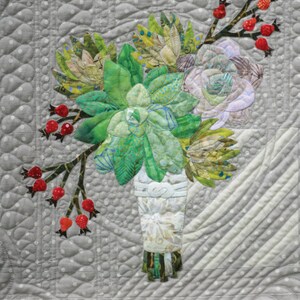 May include: A quilt block featuring a bouquet of succulents and rose hips in a white vase. The block is titled "16th and Baltimore" and is part of the "Succulents and Rose Hips" series. The block is 18 inches by 18 inches.