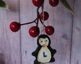 Personalised Christmas penguin decorations, ceramic hanging tree ornaments