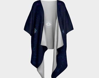 May include: A dark blue kimono-style cardigan with a celestial design. The outer fabric features a speckled pattern with purple and teal accents. The interior is a light gray. A white eye graphic is visible on the inside.