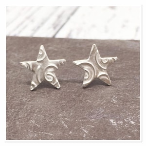 Small solid silver star earrings, sterling silver studs, swirly star earrings, fine silver studs