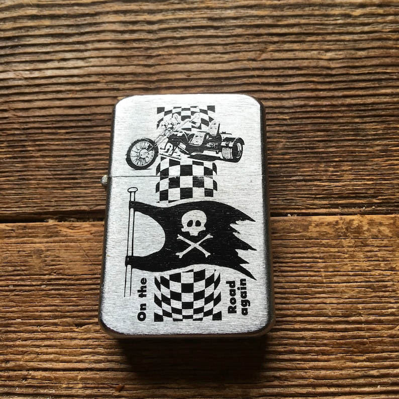 Deadstock tristar petrol lighter with trike decal on thefront