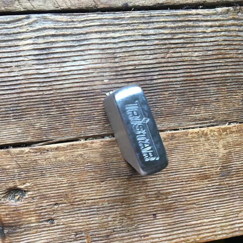 Deadstock tristar petrol lighter with trike decal on thefront
