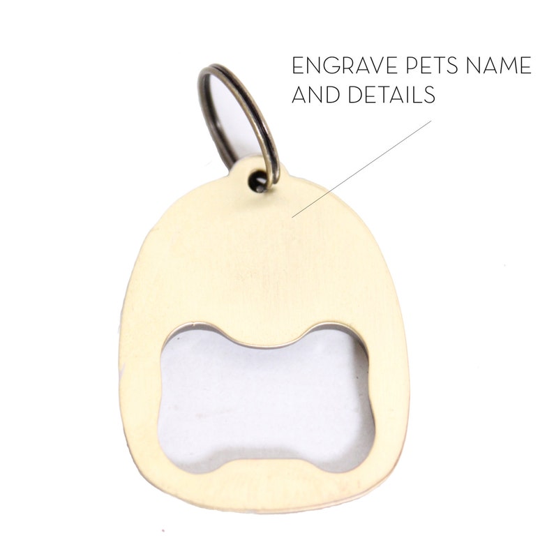 May include: A gold-coloured metal bottle opener keychain with a bone-shaped opening. The keychain has a ring for attaching to keys. The text "ENGRAVE PETS NAME AND DETAILS" is visible on the image.