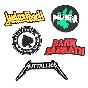 May include: Five iron-on patches featuring band logos. The patches are black, red, yellow, and green. The band names are Judas Priest, Motorhead, Bark Sabbath, Pawtera, and Metallica.