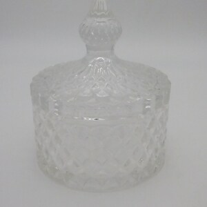 May include: A clear glass jar with a lid. The jar and lid have a diamond pattern.