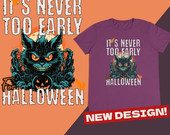Puede incluir: Camiseta morada con una ilustración de un gato negro y el texto "It's never too early for Halloween". El texto "New Design!" está en rojo en la parte inferior de la imagen.