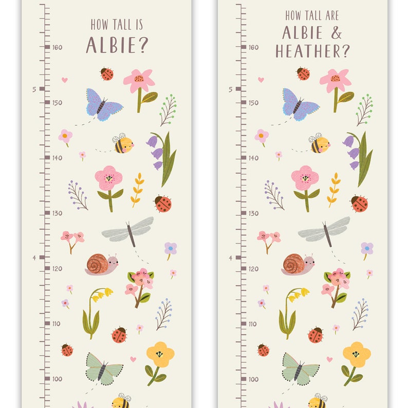 May include: Two colorful growth charts with a floral theme. The charts feature a ruler with measurements from 100 to 160 inches. The charts are decorated with butterflies, ladybugs, bees, flowers, and other nature-inspired elements. The text on the charts reads "How tall is Albie?" and "How tall are Albie & Heather?"