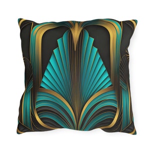 May include: A square decorative pillow features a teal and gold Art Deco design. The geometric pattern is composed of stylized teal fan shapes framed by gold lines against a dark background. The pillow is shown from a slightly elevated angle, showcasing its texture and color details.  The design evokes a sense of luxury and sophistication, suitable for modern or vintage-inspired home decor. The pillow's dimensions are not specified in the image.