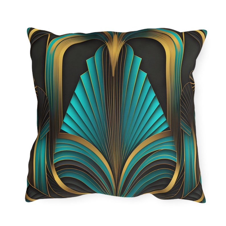 May include: A square decorative pillow features a teal and gold Art Deco design. The geometric pattern is composed of stylized teal fan shapes framed by gold lines against a dark background. The pillow is shown from a slightly elevated angle, showcasing its texture and color details.  The design evokes a sense of luxury and sophistication, suitable for modern or vintage-inspired home decor. The pillow's dimensions are not specified in the image.