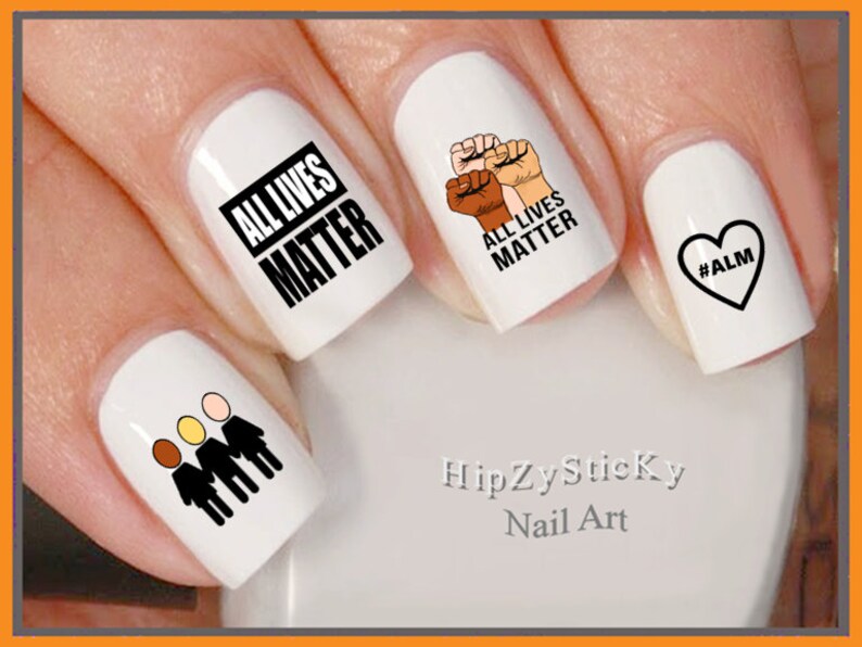 May include: White nail art stickers with black text and graphics. Designs include the text "ALL LIVES MATTER", a fist with three skin tones, a heart with "#ALM", and three stick figures with different skin tones. The brand name "HipZySticky Nail Art" is also visible.