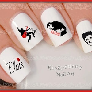 May include: White nail art featuring Elvis Presley designs. The designs include a silhouette of Elvis playing guitar, a silhouette of Elvis with the word "ELVIS", a portrait of Elvis, and the word "Elvis" with a heart.
