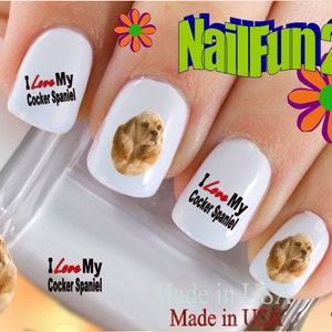 May include: Nail art decals featuring a cocker spaniel dog with the text "I Love My Cocker Spaniel" on white nail tips. The decals are made in the USA.