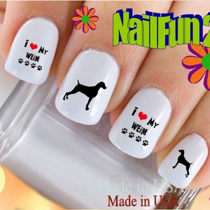 May include: White nail art with black Weimaraner dog silhouettes and the text "I ❤️ MY WEIM" with paw prints. The design includes the text "NailFun2U" and "Made in USA".