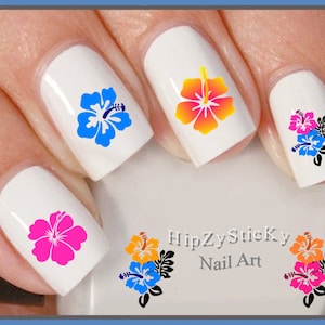 May include: Close-up of fingernails with colorful hibiscus flower nail art decals. The decals are in shades of blue, pink, orange, and yellow. The text "HipZySticKy Nail Art" is visible in the image.