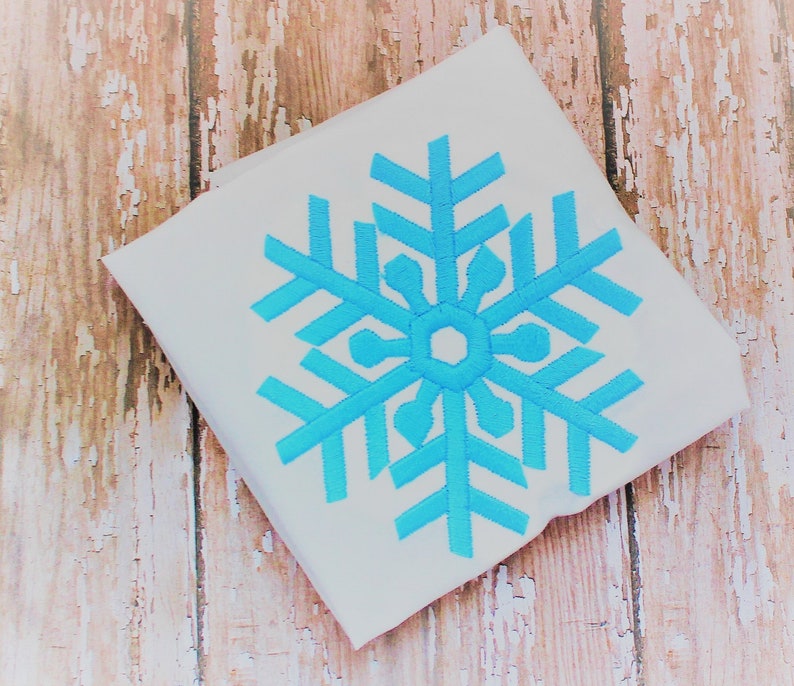 Diseño de bordado de copo de