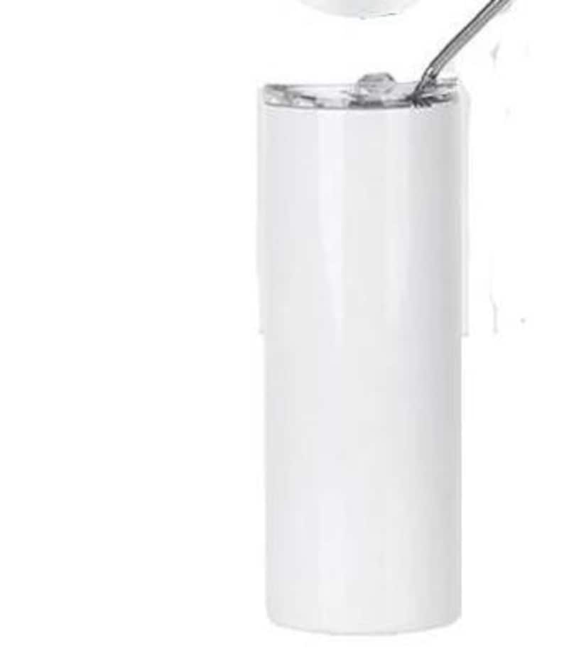 May include: A white, cylindrical tumbler with a lid and a metal straw. The tumbler is made of a glossy material and has a clean, minimalist design. The lid is partially open, and the straw is inserted into the opening. The tumbler is designed for cold beverages.