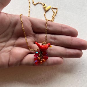 Vintage Lenora Dame gold tone chain with glass red bird pendant necklace