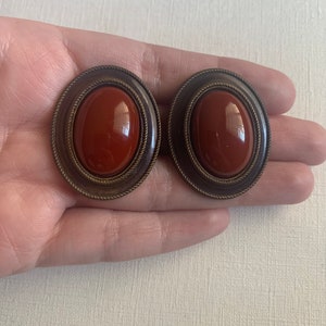Vintage distressed gold tone auburn color cabochon clip on earrings