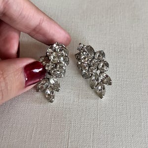 Vintage Mid-century silver tone clear rhinestone dimensional clip on earrings