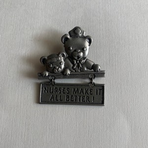 Vintage JJ silver tone nurse teddy bear brooch
