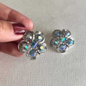 Vintage Mid-century silver tone aurora borealis rhinestone flower round clip on earrings