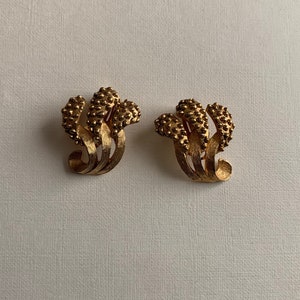Vintage gold tone textured clip on earrings