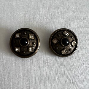 Vintage gold tone rhinestone and black cabochon center round clip on earrings