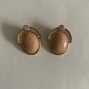 Vintage gold tone cream enamel and rhinestone accents clip on earrings