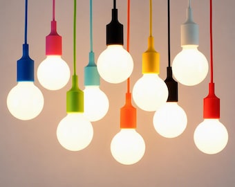 May include: A collection of ten pendant lights with round, glowing white bulbs. Each bulb features a distinct coloured socket and matching cord in blue, pink, lime green, light blue, black, orange, yellow, black, white, and red.