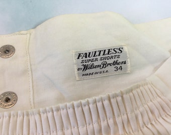 May include: White cotton shorts with a white label that reads "Faultless Super Shorts by Wilson Brothers Made in U.S.A. 34".