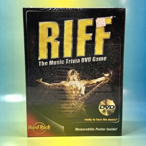 May include: A black box with a gold RIFF logo and the text "The Music Trivia DVD Game". The box features a photo of a person playing a guitar. The box also includes the text "Hard Rock" and "DVD".