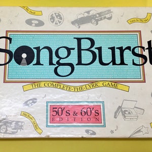 May include: A white box with a blue and white title card that reads "SongBurst The Complete-The-Lyric Game 50's & 60's Edition". The box has illustrations of a record player, a guitar, a car, and a peace sign.