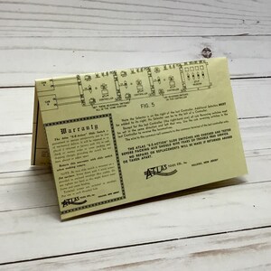 May include: A yellow instruction sheet for an Atlas E-Z-Action Slide Switch. The sheet includes a diagram of the switch and a warranty statement. The warranty states that the switches are checked and tested before packing and should give years of trouble-free service. No repairs or replacements will be made if returned abused or taken apart.