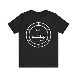 May include: Black t-shirt with a white sigil of the demon Leviathan. The sigil is a circle with the letters "L.I.H.I.T.I.L" around the outside and a cross with a serpent inside the circle.