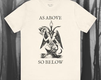 May include: A white t-shirt with a black and white illustration of a goat-like figure with wings and horns. The text "As Above So Below" is printed on the shirt.