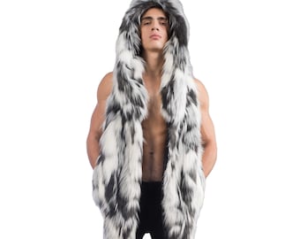 May include: A white and black faux fur vest with a large hood. The vest is sleeveless and has a long, flowing design.