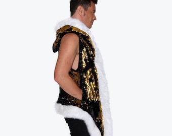 May include: A sleeveless vest with a black and gold sequined front, a white faux fur trim, and a hood. The vest is paired with black pants and boots. The overall style is glamorous and eye-catching.