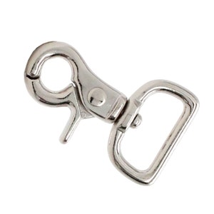 May include: Silver metal swivel snap hook with a D-ring. The hook is open and ready to be attached to a leash, strap, or other item.