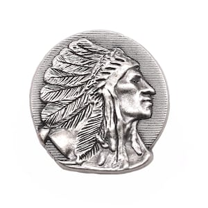 May include: Silver-toned metal coin featuring a detailed profile of a Native American man wearing a headdress with feathers.
