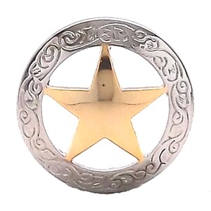 May include: A silver-toned metal star with a gold-toned center, surrounded by a decorative border. The star is a classic Western design.