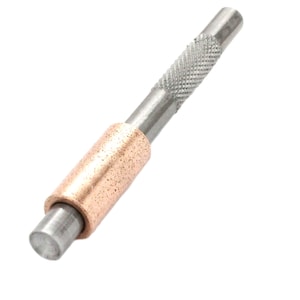 May include: A silver metal tool with a brown abrasive tip. The tool has a textured handle for a secure grip.