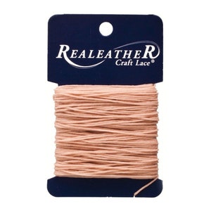 May include: A spool of pale pink Real Leather Craft Lace, wound on a blue card with the brand name and "Craft Lace" printed in white.