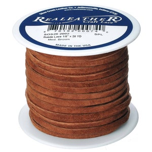 May include: A spool of brown suede leather lace, 1/8 inch wide, with a label that reads "Real Leather Craft Lace" and "SOS25 2002 Suede Lace 1/8" x 26 YD Med. Brown" and "Made in the USA".