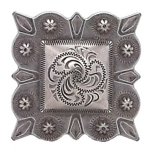 May include: Silver-toned metal belt buckle with a square design. The buckle has a detailed floral pattern around the edges and a swirling, intricate design in the center.
