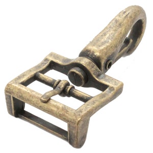 May include: Antique brass swivel hook with a rectangular buckle. The hook is closed and the buckle is open.